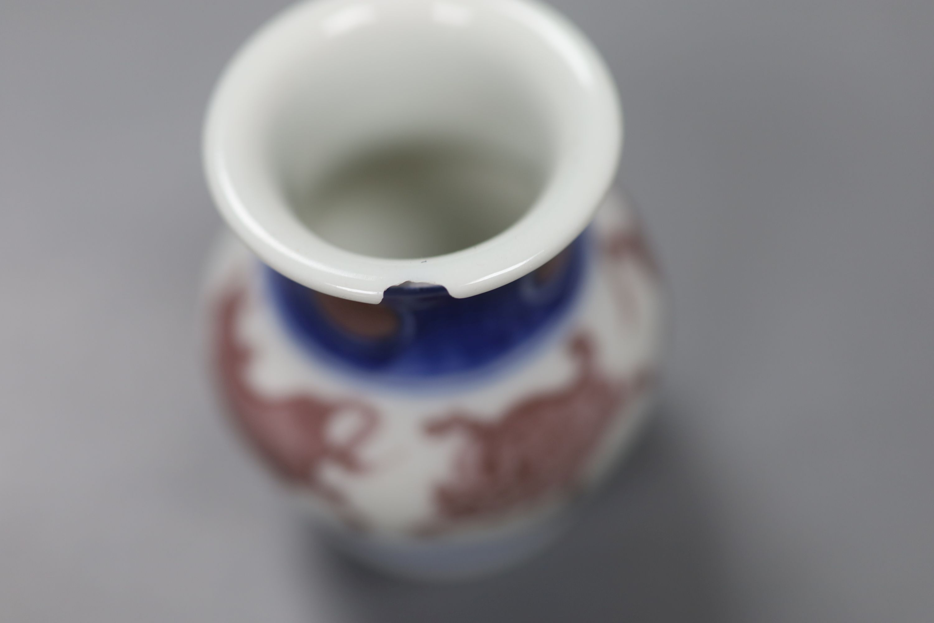 Makuzu Kozan. An underglaze blue and copper red small jar, height 6.5cm